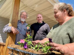 Members of the drop-in Center in Park Rapids planting flowers.
