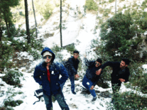 Guys throwing snowballs