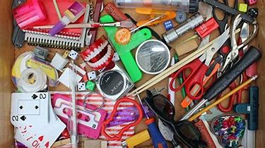 Cluttered desk drawer.